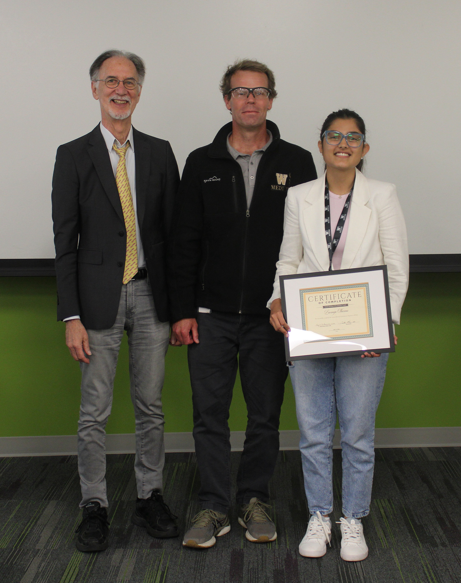 Lavanya Sharma, participant in Science Research Enrichment Program 2026 cohort, with Thomas L. Rothstein, MD, PhD, and Michael Gutknecht, PhD