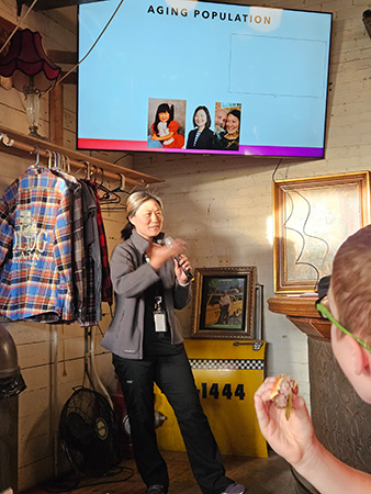 Julie VanGyseghem, PhD, presents at a Science on Tap session at Old Dog Tavern
