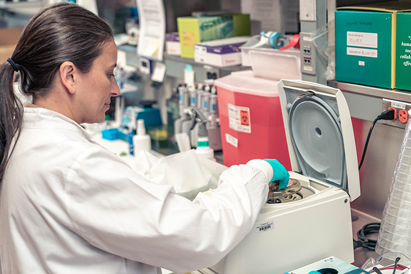 Nichol Holodick, PhD, adjusts equipment in her lab