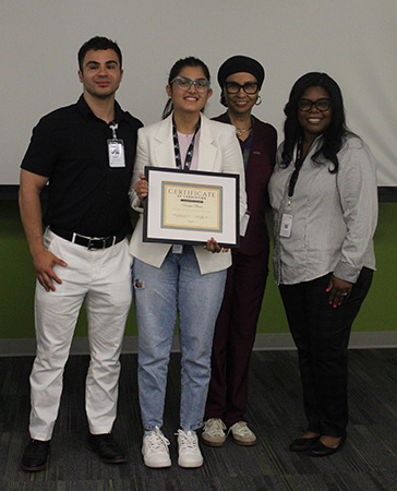 Lavanya Sharma, participant in WMed Science Research Enrichment Program 2026 cohort, with Cheryl Dickson, MD, MPH, Candace Moore, and Joey Cervone