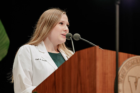 WMed M4 Karli Crouch speaks at the Class of 2030 White Coat Ceremony