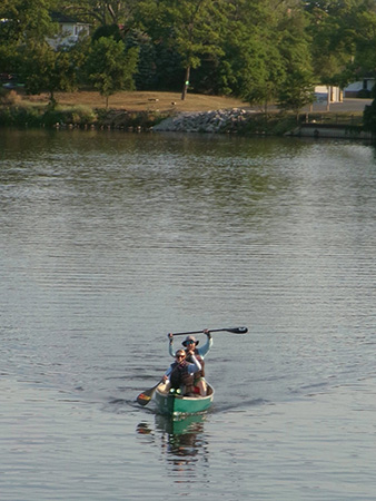 M4 Marina Cox and her father, Jim Cox, prepare to cross the finish line at the Consumers Energy AuSable River Challenge 120