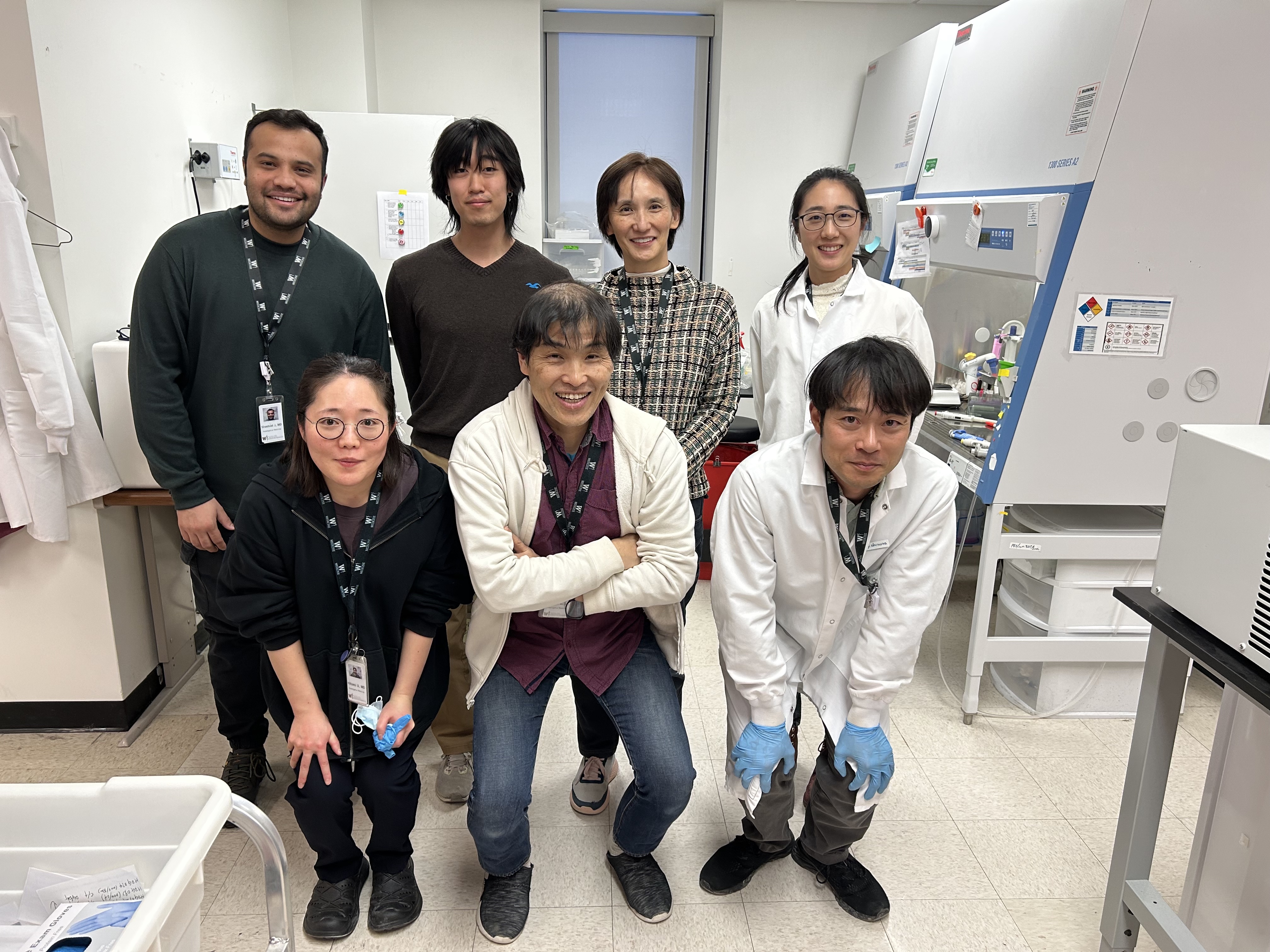 Momoko Yoshimoto, MD, PhD, with her lab team in the Center for Immunobiology at WMed